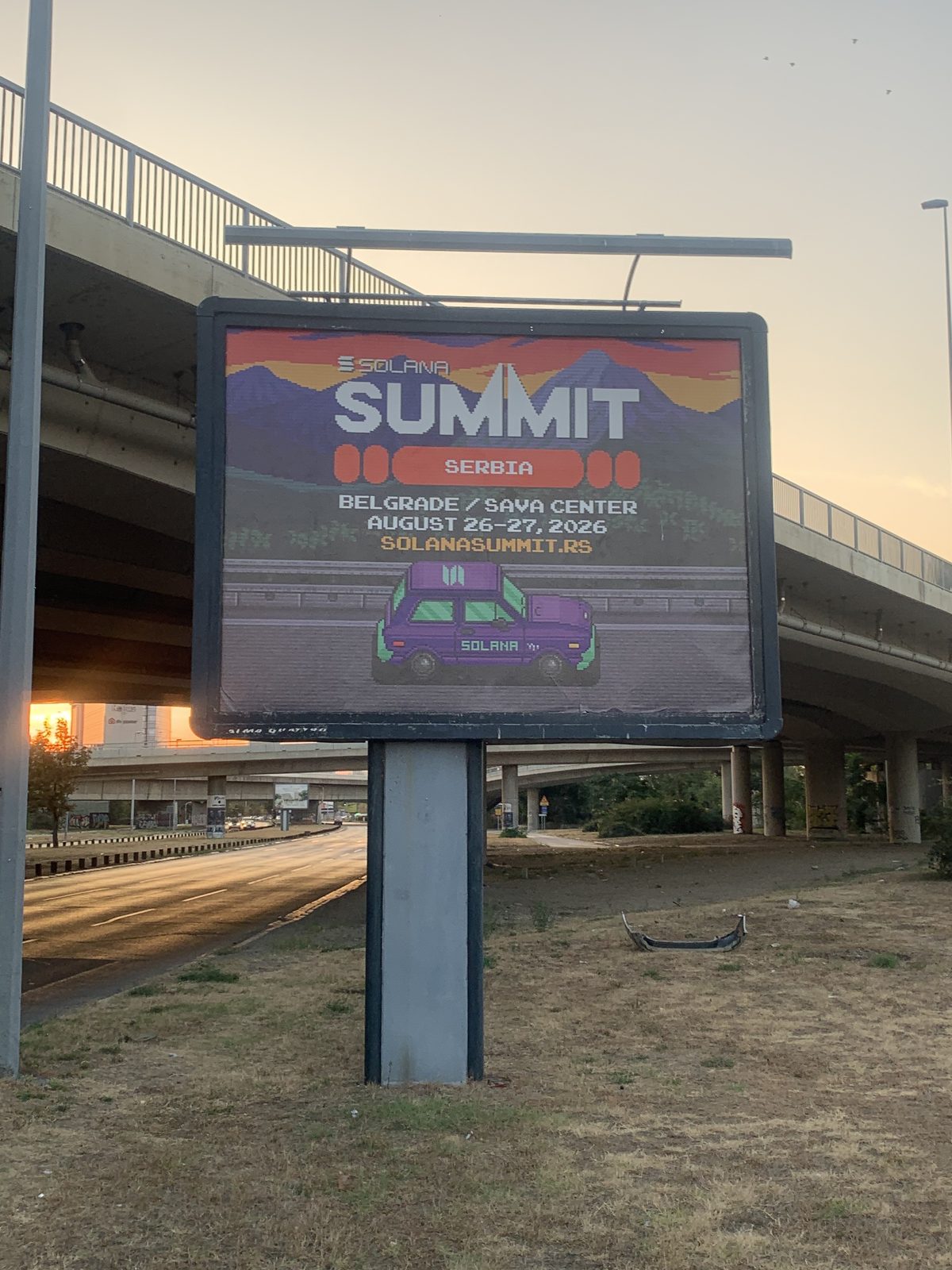 Solana Summit Serbia billboard in Belgrade at sunrise, advertising the event at Sava Center on August 26–27, 2026